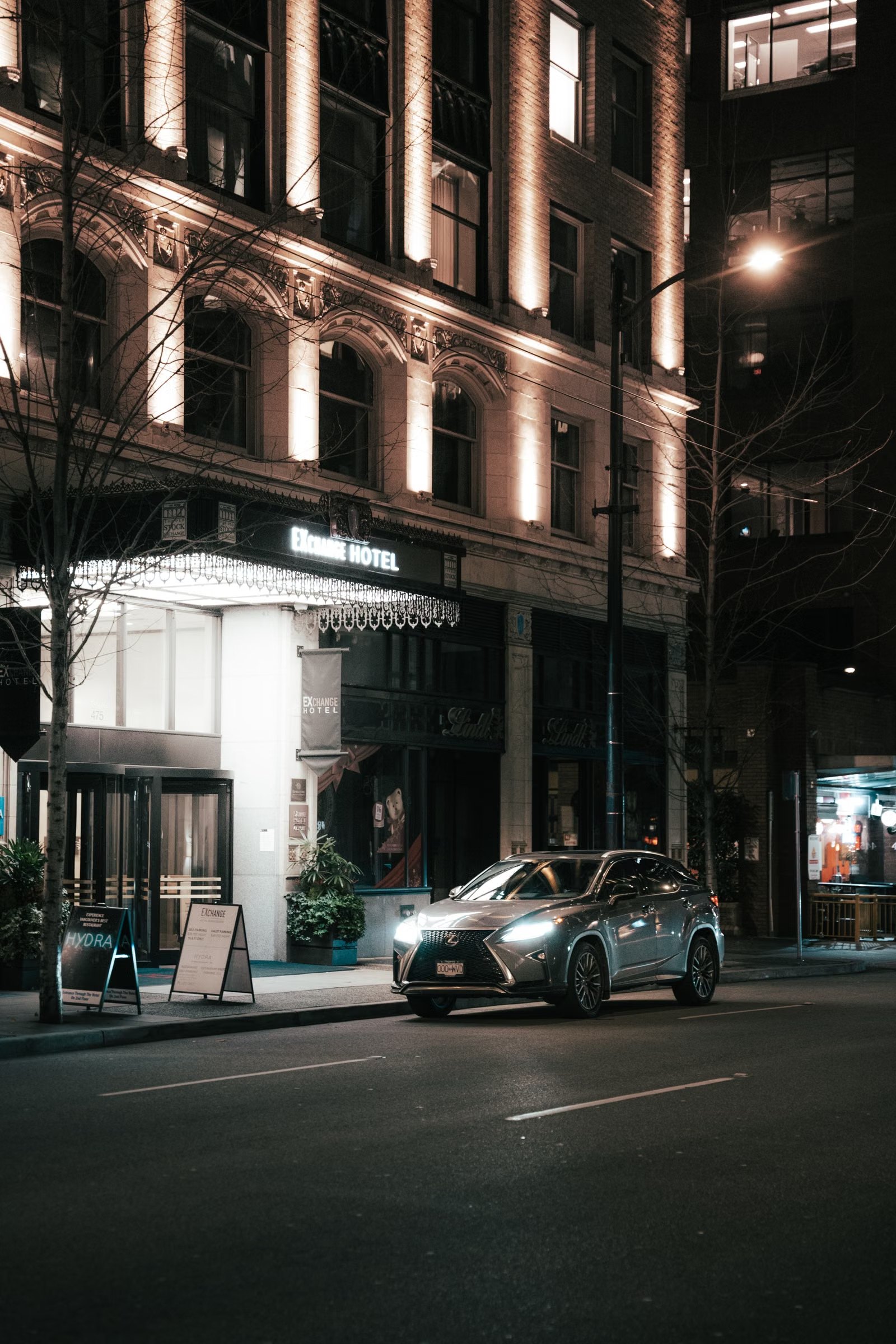 Luxury vehicle at hotel entrance